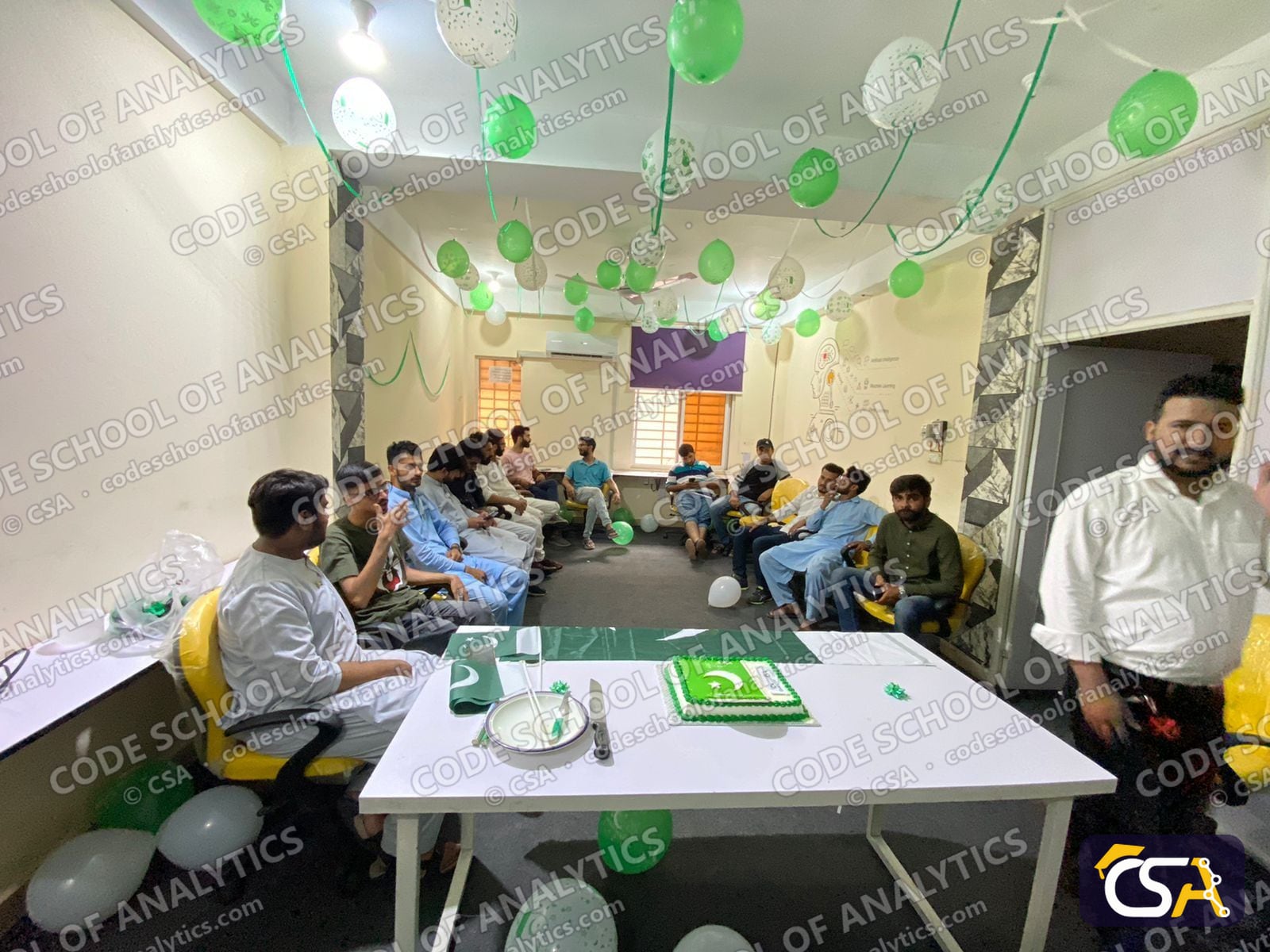 Decorated room with students and staff at the Independence Day celebration