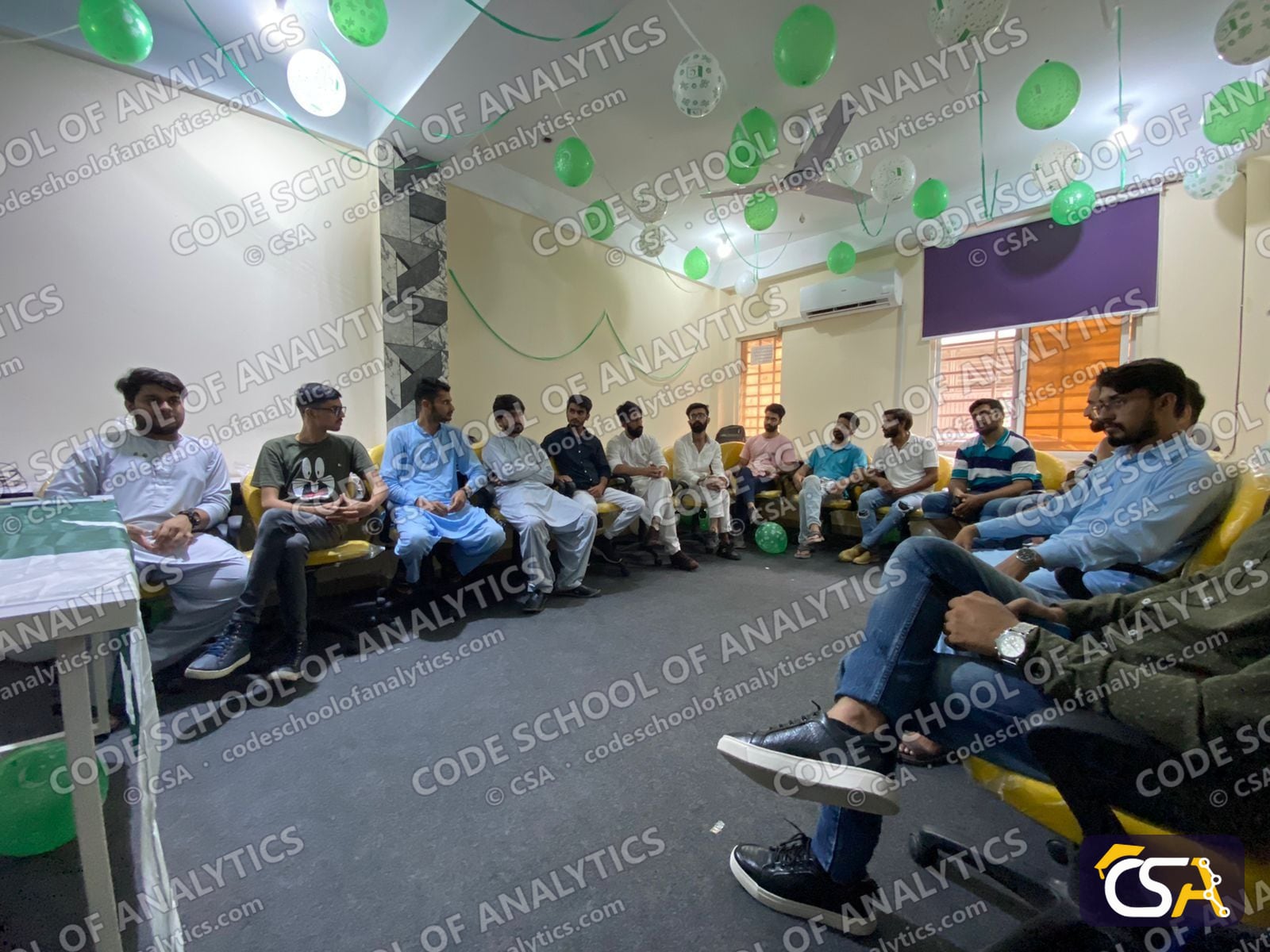 Students seated around the decorated CSA hall