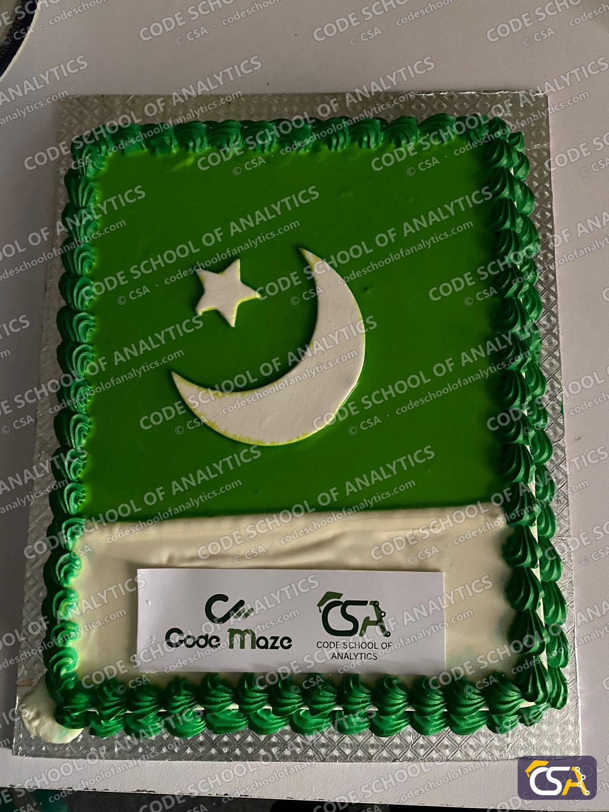 Independence Day cake with the Code Maze and CSA logos