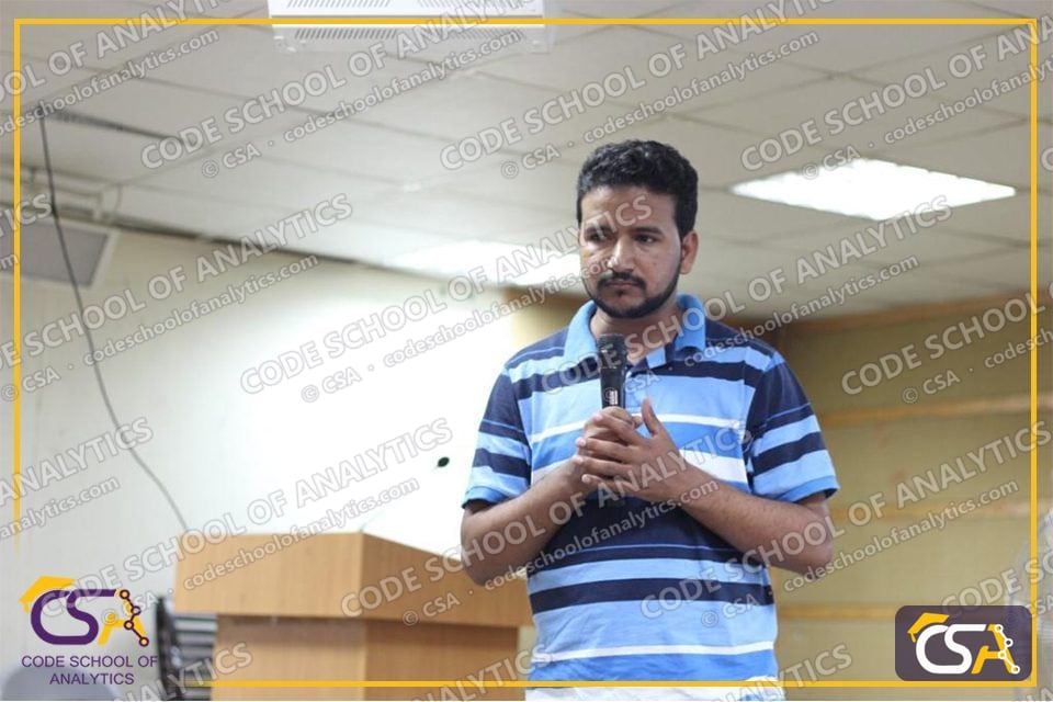 CSA speaker talking to students with a microphone at the FUAAST seminar