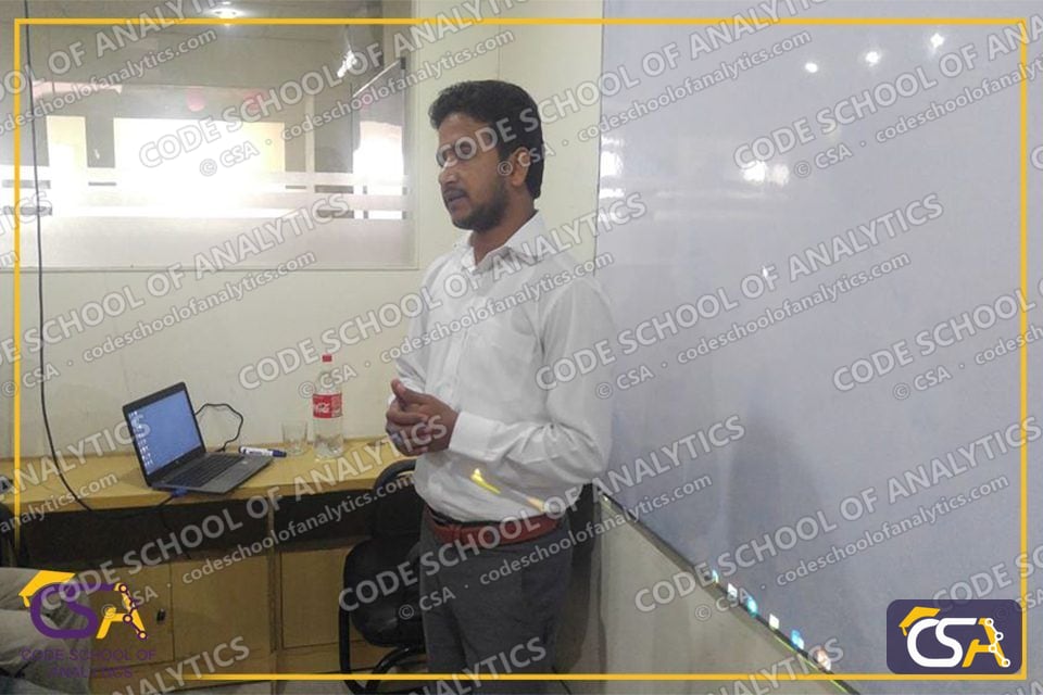 CSA instructor speaking beside the whiteboard