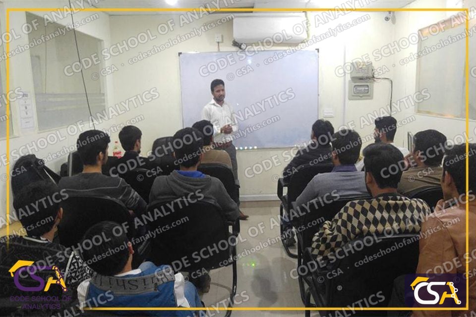Instructor speaking to a full classroom